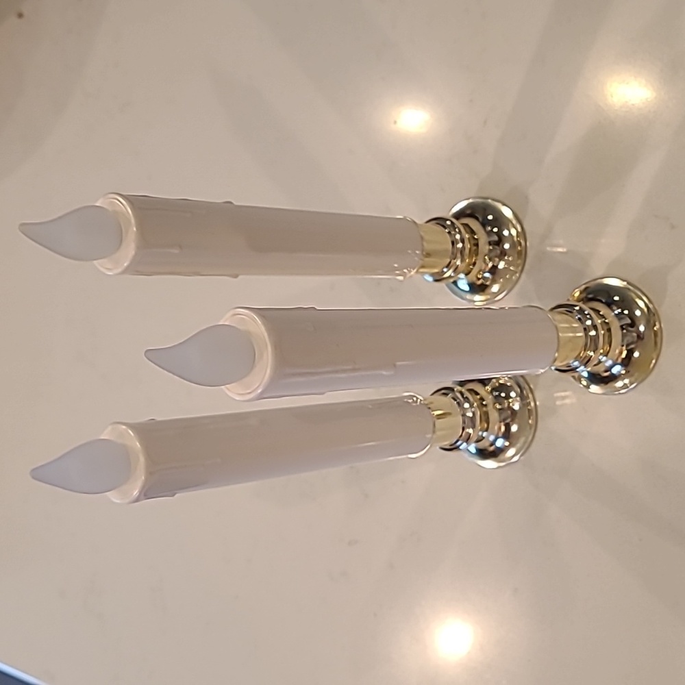 3 Gold/ silver toned Candle holder with candles